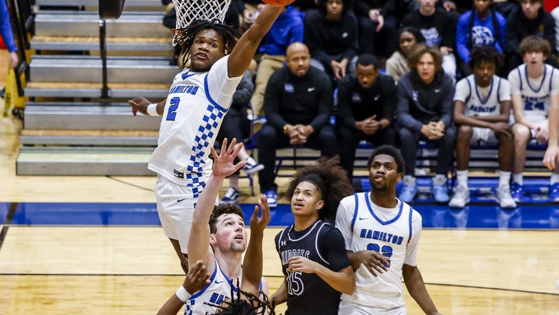 Hamilton's Andrea Holden jumps up to block a shot during the Hamilton vs. Middletown basketball game Tuesday, Jan. 30, 2024 at Hamilton High School. Middletown won 47-38. NICK GRAHAM/STAFF