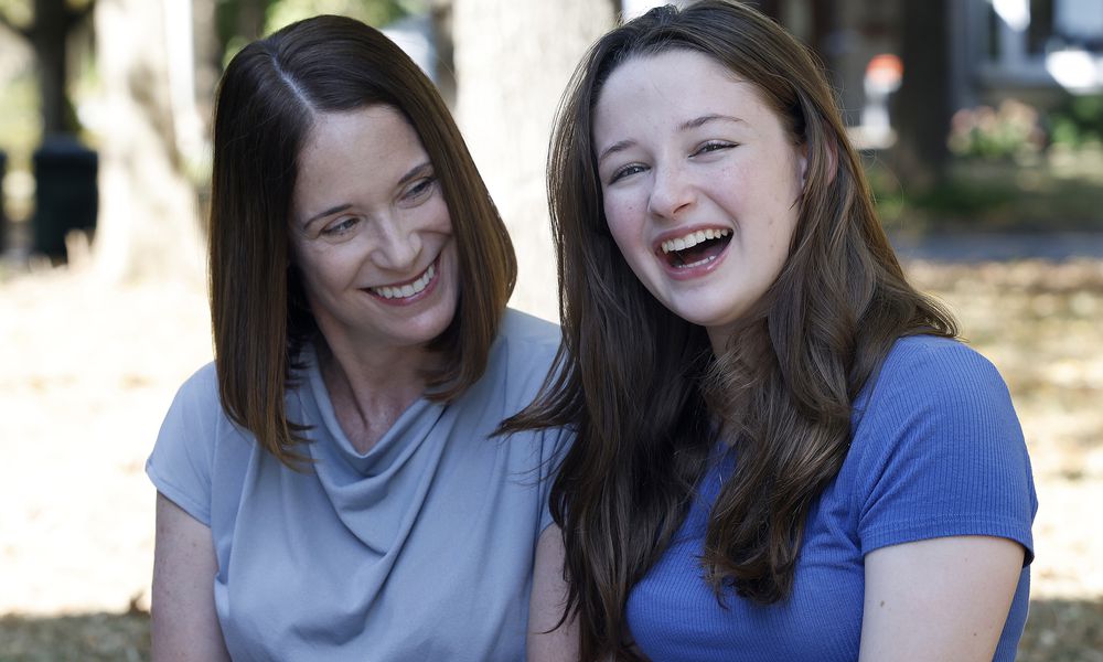 Erin Handler, left, with her daughter, Kay at the Wright Library in Oakwood. MARSHALL GORBY\STAFF