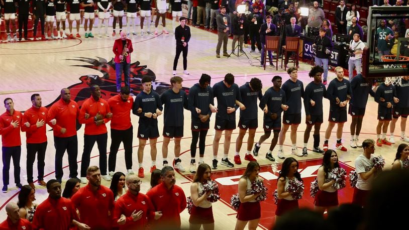 Dayton stands for the national anthem before a game against Saint Joseph’s on Tuesday, Feb. 6, 2024, at Hagan Arena in Philadelphia. David Jablonski/Staff