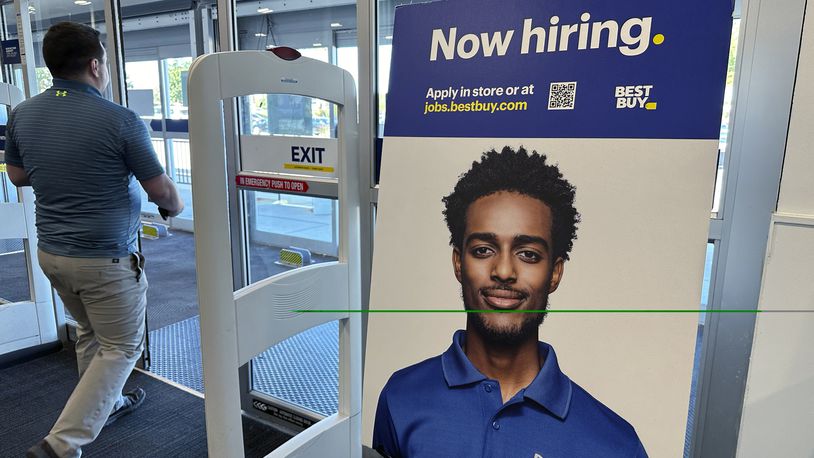 A hiring sign is displayed at a retail store in Vernon Hills, Ill., Saturday, Sept. 7, 2024. (AP Photo/Nam Y. Huh)