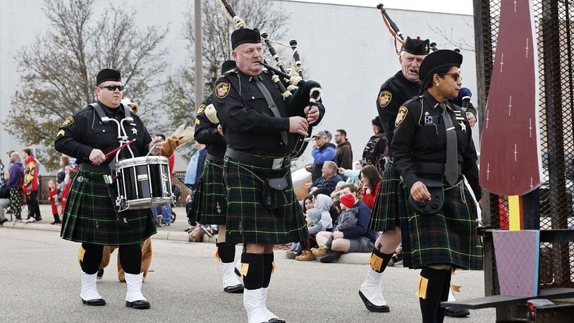 The inaugural St. Patrick's Day Parade in Middletown, which steps off at 4 p.m. March 16 from Curtis Street and Central Avenue and travels down Central to Governor's Square, is expected to be large with more than 30 groups and floats, including two pipe and drum bands: the Butler County Sheriff's Office Pipe and Drum Corp and the Cincinnati Caledonian Pipes & Drums. Above is a pipe and drum band that participated in the 2022 Santa Parade. NICK GRAHAM/STAFF