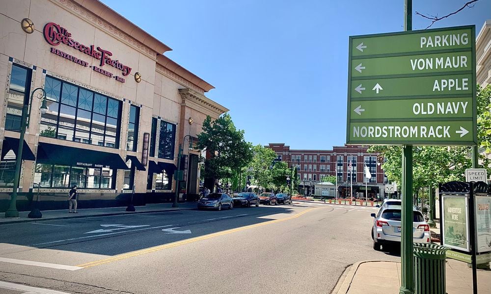 Signage points shoppers to some of the 100-plus stores and restaurants at The Greene Town Center in Beavercreek on Tuesday, May 16, 2024. MARSHALL GORBY / STAFF