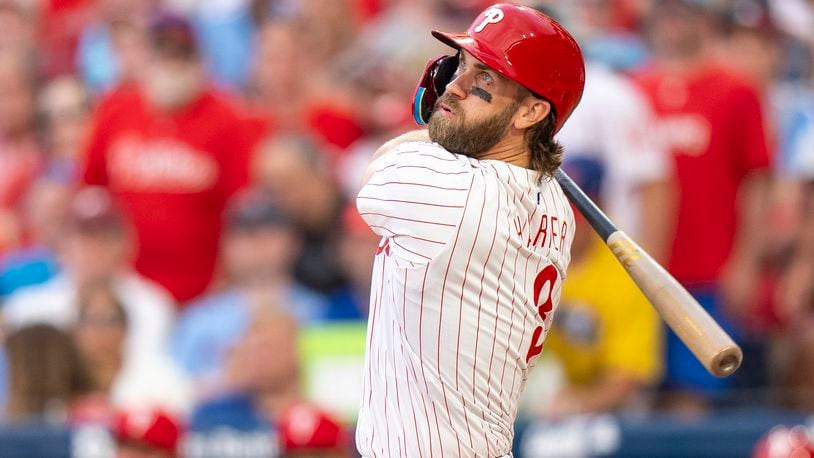 FILE - Philadelphia Phillies' Bryce Harper bats during a baseball game against the Milwaukee Brewers, Monday, June 3, 2024, in Philadelphia.The Phillies have reinstated first baseman Bryce Harper and designated hitter Kyle Schwarber from the 10-day injured list and could have both key players as they face the Los Angeles Dodgers in a matchup of division leaders. (AP Photo/Chris Szagola, Filer)