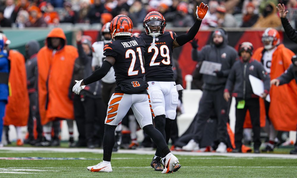 Cincinnati Bengals cornerback Mike Hilton (21) and Cam Taylor-Britt (29) celebrate a tackle for a loss against the Cleveland Browns during the first half of an NFL football game in Cincinnati, Sunday, Jan. 7, 2024. (AP Photo/Jeff Dean)