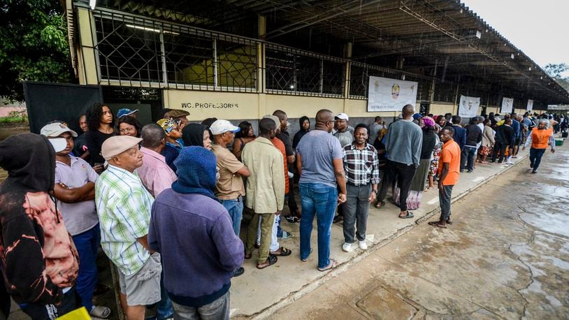 People queue to cast their votes during general elections in Maputo, Mozambique, Wednesday, Oct. 9, 2024. (AP Photo/Carlos Equeio)