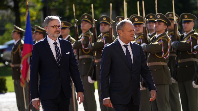 Czech Republic's Prime Minister Petr Fiala, left, welcomes his Poland's counterpart Donald Tusk as they meet in Prague, Czech Republic, Wednesday, Oct. 9, 2024. (AP Photo/Petr David Josek)