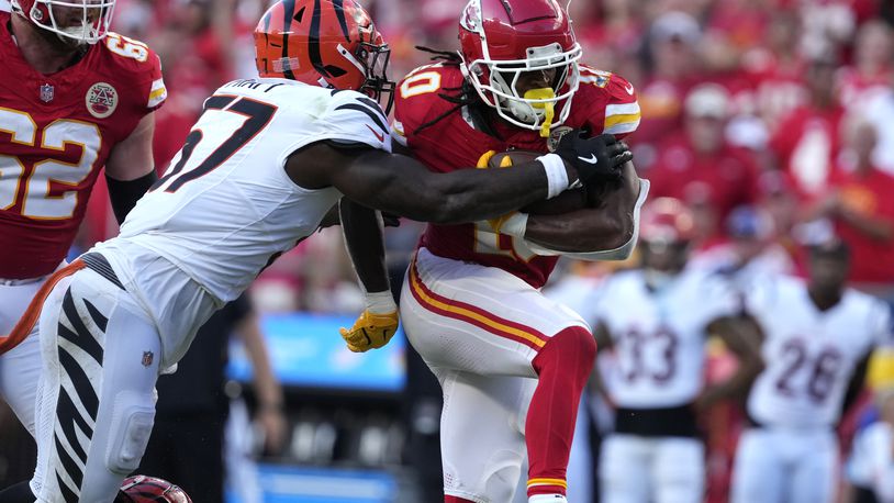 Kansas City Chiefs running back Isiah Pacheco, right, runs with the ball as Cincinnati Bengals linebacker Germaine Pratt (57) defends during the second half of an NFL football game Sunday, Sept. 15, 2024, in Kansas City, Mo. (AP Photo/Ed Zurga)