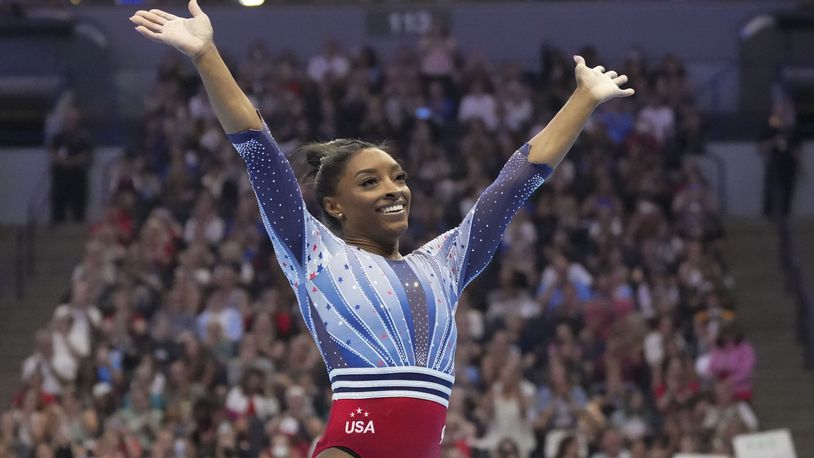 Simone Biles smiles after the floor exercise at the United States Gymnastics Olympic Trials on Friday, June 28, 2024, in Minneapolis. (AP Photo/Charlie Riedel)