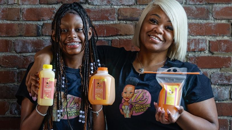 Ziya Mccullar (left) and her mom, Joyous Johnson, are the owners of Zs Lemonade Stand in Dayton. JIM NOELKER/STAFF