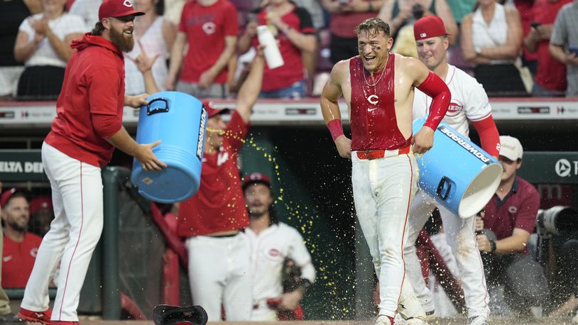 Cincinnati Reds' TJ Friedl reacts after being doused after he hit a walk-off single during the ninth inning of a baseball game against the Oakland Athletics, Thursday, Aug. 29, 2024, in Cincinnati. The Reds won 10-9. (AP Photo/Carolyn Kaster)