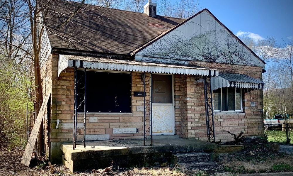 This house at 1534 Weaver Street, Dayton, was at the center of a quitclaim deed fraud case. MARSHALL GORBY\STAFF