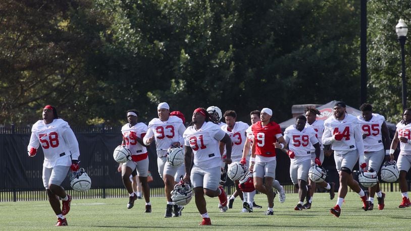 Players run to a drill at the first Ohio State football practice of the season on Thursday, Aug. 1, 2024, at the Woody Hayes Athletic Center in Columbus. David Jablonski/Staff