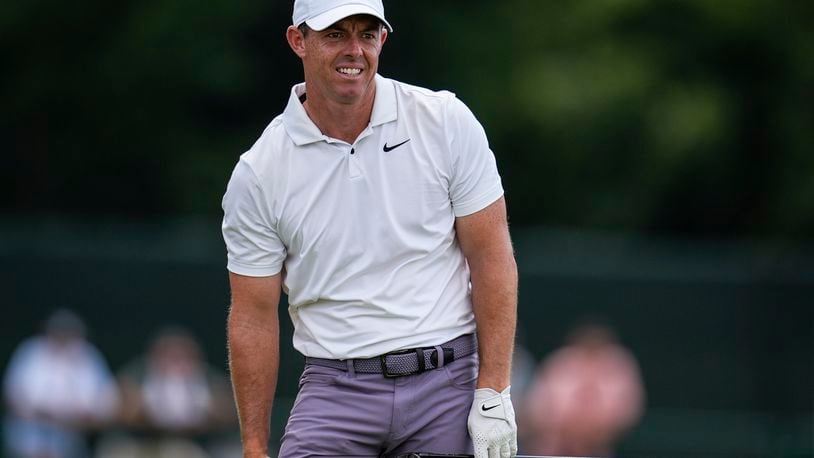 Rory McIlroy, of Northern Ireland, watches his ball on the eighth hole during the second round of the Tour Championship golf tournament, Friday, Aug. 30, 2024, in Atlanta. (AP Photo/Mike Stewart)