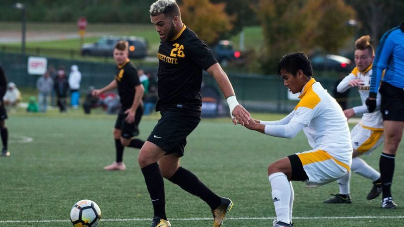 Wright State’s Austin Kinley (26) shields a Milwaukee defender from the all during last week’s Horizon League semifinal at Alumni Field. Joseph Craven/CONTRIBUTED