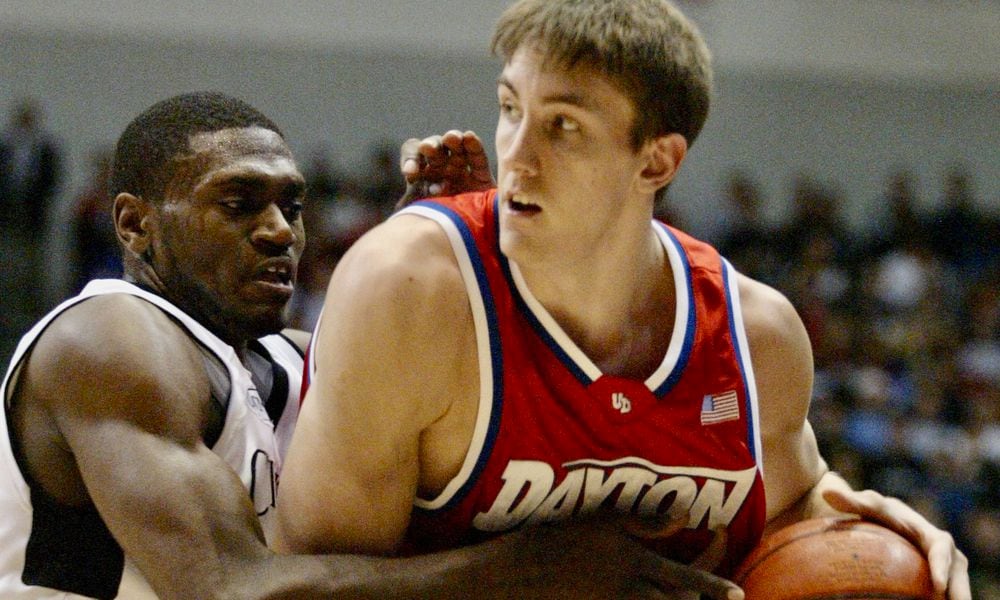 Jason Maxiell, of Cincinnati, left, defends Dayton's Sean Finn in a game in Cincinnati on Dec. 23, 2003. Lisa Powell/Staff