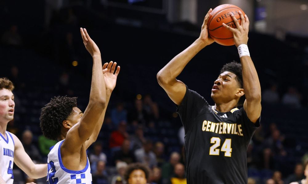 Centerville's Baboucarr Njie puts up a shot during their Division I regional semifinal basketball game against Hamilton Wednesday, March 13, 2024 at Xavier University's Cintas Center. Centerville won 60-35. NICK GRAHAM/STAFF