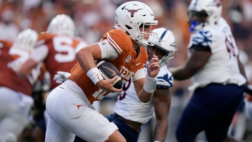 Texas quarterback Arch Manning (16) runs for a 67-yard touchdown against UTSA during the first half of an NCAA college football game in Austin, Texas, Saturday, Sept. 14, 2024. (AP Photo/Eric Gay)