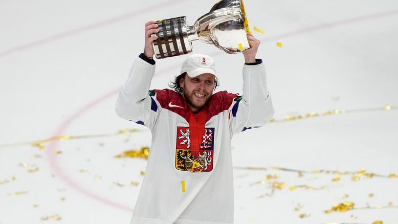 Czech Republic's David Pastrnak celebrates with their trophy after they defeated Switzerland 2-0 in a gold medal match at the Ice Hockey World Championships in Prague, Czech Republic, Sunday, May 26, 2024. (AP Photo/Darko Vojinovic)