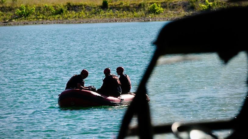 Rescue crews from Dayton, Piqua and Wright Patterson Air Force Base search a lake near Action Sports Monday, July 1, 2024 in Dayton. A swimmer was seen struggling in the water Sunday evening. MARSHALL GORBY\STAFF