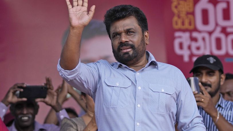 FILE -Leader and the presidential candidate of National People's Power Anura Kumara Dissanayake waves to supporters during a public rally in Dehiowita, Sri Lanka, Sept. 17, 2024. (AP Photo/Eranga Jayawardena, File)