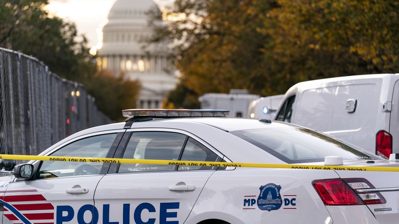 FILE - A Washington Metropolitan Police vehicle is seen near the Capitol, Oct. 19, 2022, in Washington. Police on Friday arrested a 15-year old boy on charges related to threats on social media that prompted an increased police presence at multiple schools in the nation's capital. The Instagram post showing a firearm and a list of D.C. schools prompted police to station officers at several different schools on Thursday. (AP Photo/J. Scott Applewhite, File)