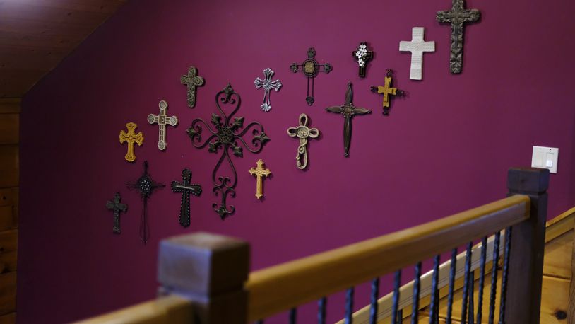 Crosses hang from one of the walls at the Rev. Ron Blakely’s home near Watertown, Tenn., on Friday, July 26, 2024. (AP Photo/Luis Andres Henao)