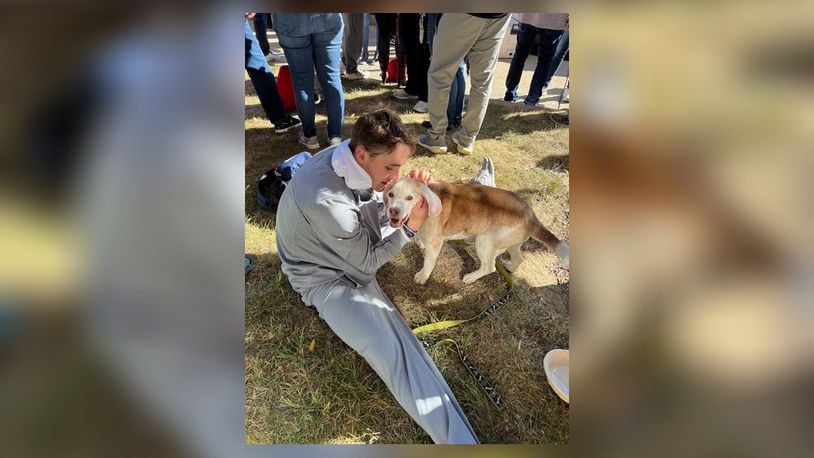 Dayton football player Luke Brenner and his late dog, Buddee. CONTRIBUTED