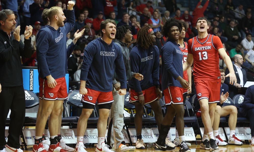 The Dayton bench reacts to a basket during a game against La Salle on Tuesday, Jan. 23, 2024, at Tom Gola Arena in Philadelphia. David Jablonski/Staff