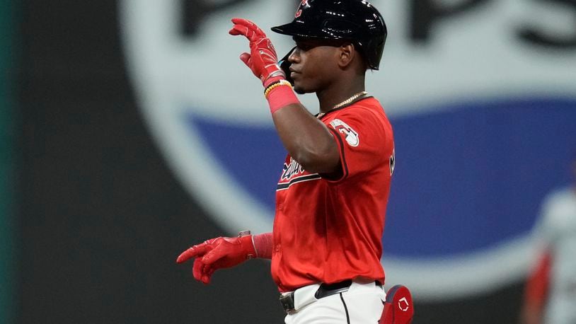 Cleveland Guardians' Angel Martinez gestures from second base after hitting a double in the fifth inning of a baseball game against the Minnesota Twins, Monday, Sept. 16, 2024, in Cleveland. (AP Photo/Sue Ogrocki)