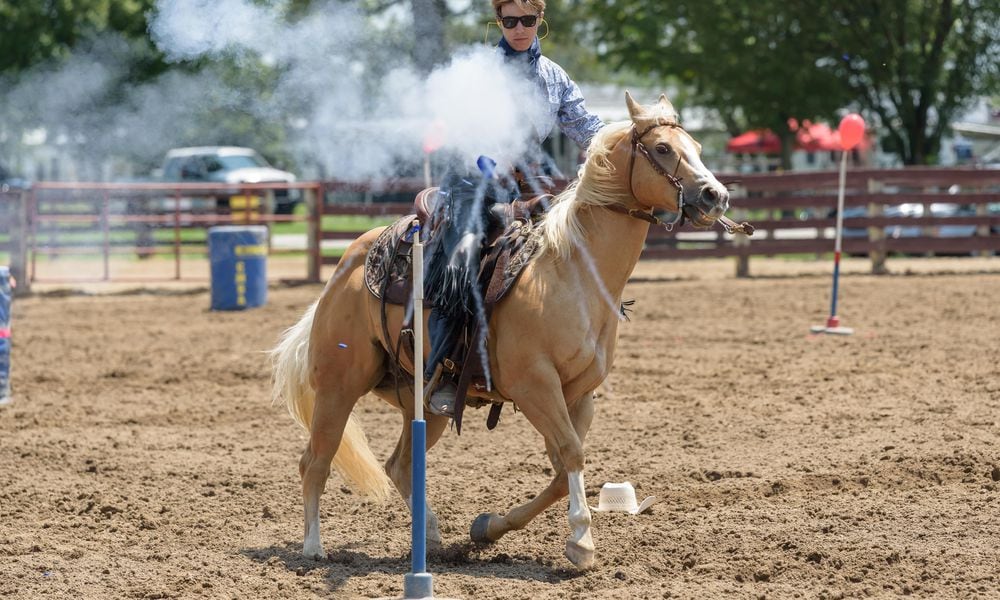 The Annie Oakley Festival celebrated its 60th anniversary from Friday, July 26 to Sunday, July 28 at the Darke County Fairgrounds in Greenville. Featured activities on Saturday included live music by identical twins Spittinâ Image, Cowboy Mounted Shooting Association competition, fast draw competition and more. TOM GILLIAM / CONTRIBUTING PHOTOGRAPHER