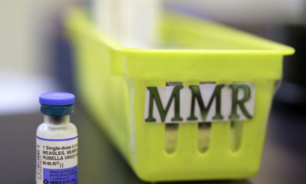 FILE - A vial of a measles, mumps and rubella vaccine sits on a countertop at a pediatrics clinic in Greenbrae, Calif., on Feb. 6, 2015. (AP Photo/Eric Risberg, File)