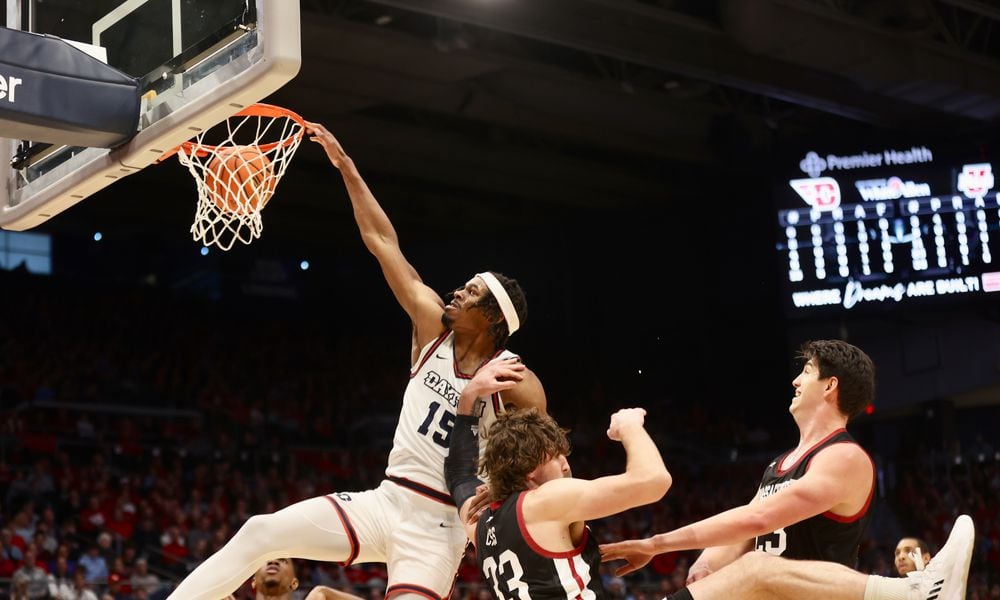 Dayton's DaRon Holmes II dunks against Massachusetts on Sunday, Jan. 7, 2024, at UD Arena. David Jablonski/Staff