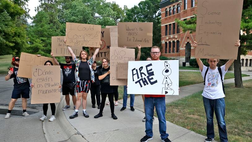 A group of Wittenberg University students and faculty protest the recently announced budget cuts to programs and staff outside of Recitation Hall Friday, Sept. 6, 2024. BILL LACKEY/STAFF