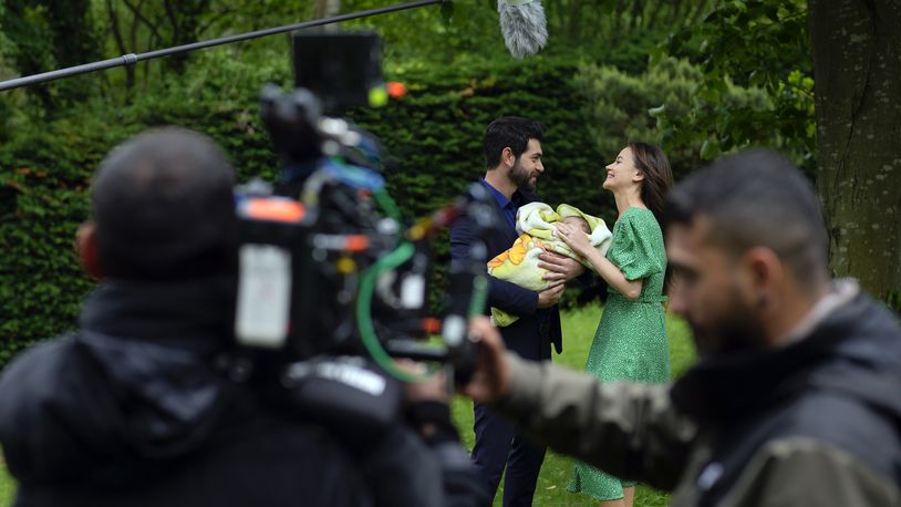 A production team is filming scenes of a Turkish drama with actor Paris Baktas and actress Yagmur Yuksel, Turkey, Tuesday, April 30, 2024. Turkey has emerged as a leading exporter of television drama, bolstering the nation’s international image and drawing millions of viewers and tourists worldwide to its historical and cultural sites which are backdrops to many of the shows. (AP Photo/Khalil Hamra)