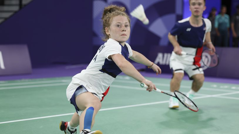 Jayci Simon, 19, left, and Mike Krajewski, 19, from the U.S., compete in their first doubles badminton match in the SH6 classification at Porte La Chapelle Arena during the Paralympic Games, on Thursday, Aug. 29, 2024, in Paris. (AP Photo/Samantha Hurley)