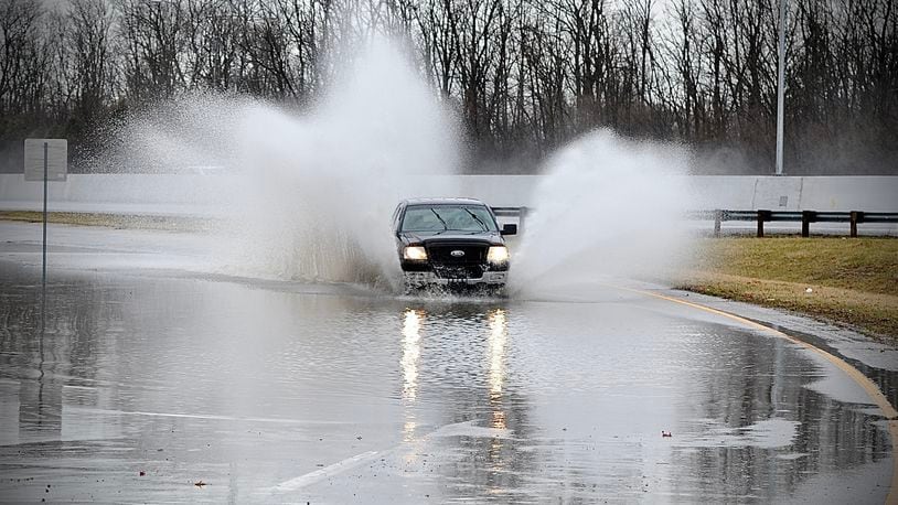 Water covered the exit ramp from U.S. 35 East onto Dayton Xenia Road Monday morning March 7, 2022. MARSHALL GORBY \STAFF