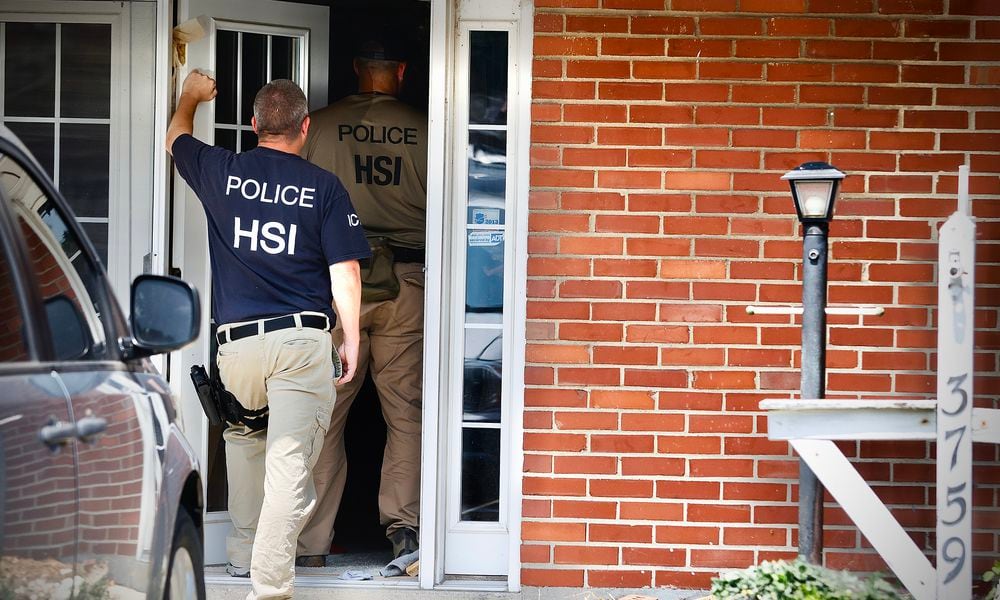 Homeland security, searching a home at 3759 Woodbury Dr., Friday, July 26, 2024. MARSHALL GORBY \STAFF