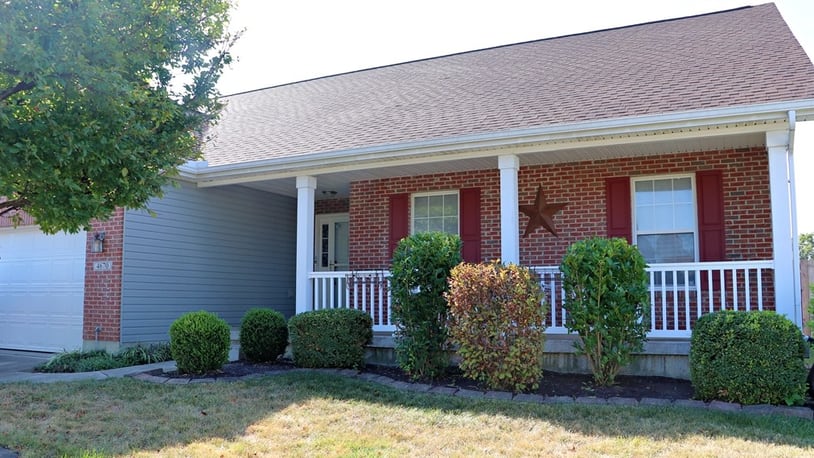 Listed for $379,900 by eXp Realty, the brick ranch at 4670 Santa Anita Place in Huber Heights has about 1,508 square feet of living space upon a full basement. A covered porch stretches across the front formal entry and a concrete driveway leads up to the two-car garage. A wooden privacy fence surrounds the spacious back yard with a tree island sitting area and storage barn. CONTRIBUTED