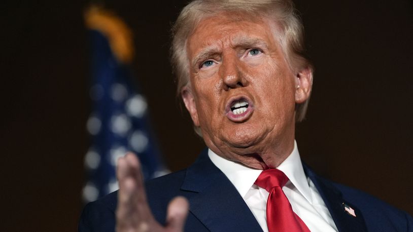 Republican presidential nominee former President Donald Trump talks with reporters at a campaign event at ll Toro E La Capra, Friday, Aug. 23, 2024, in Las Vegas. (AP Photo/Julia Nikhinson)