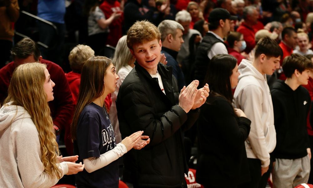 Oakwood junior Will Maxwell, third from left, and Lakota West junior Nathan Dudukovich, second from right, watch Dayton's game against Duquesne on Wednesday, Feb. 9, 2022, at UD Arena. David Jablonski/Staff