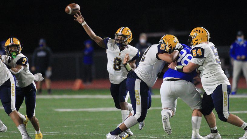 Springfield's Te'Sean Smoot throws a touchdown pass to Anthony Brown in the first half against St. Xavier in a Division I state semifinal on Friday, Nov. 6, 2020, at Alexander Stadium in Piqua. David Jablonski/Staff