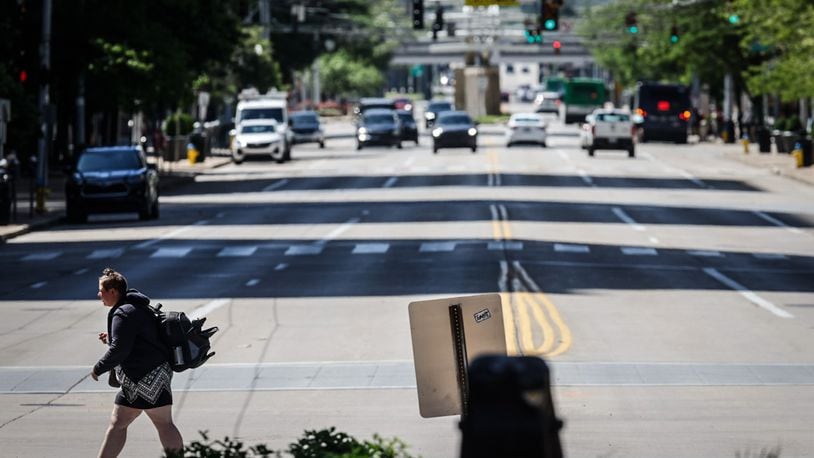 A pedestrian walks across North Main Street at First Street looking south. The city wants to make improvements on North Main Street from Monument Ave. to Sixth Street. JIM NOELKER/STAFF