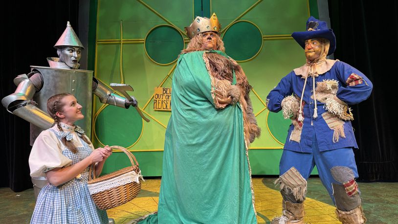 Allison Gabert (Dorothy) with Jonathan Pendergrass (Tin Man), Nate Marcum (Lion) and Dylan Jackson (Scarecrow) in La Comedia Dinner Theatre's production of "The Wizard of Oz." PHOTO BY  JUSTIN WALTON