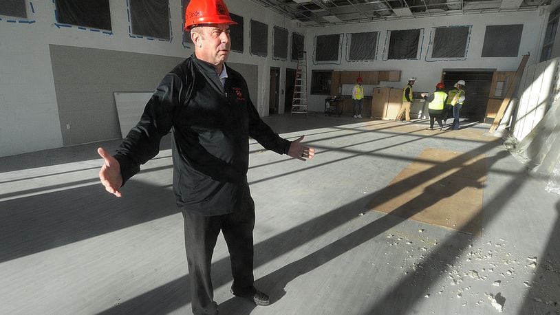 Superintendent Michael Sander talks about the natural light and the size of the band room at the new Franklin High School located on East Sixth Street. MARSHALL GORBY\STAFF