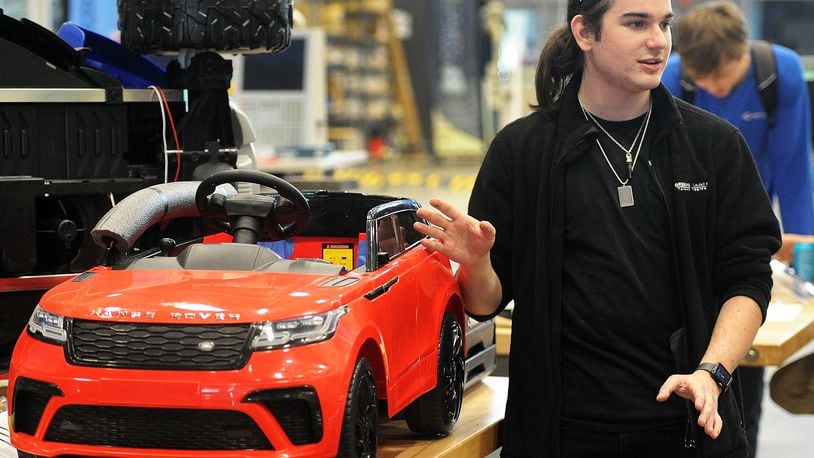 Kaden Gillespie talks about redesigning toy cars for kids with disabilities at the Greene County Career Center. Gillespie was part of a class redesigning toy cars for kids with disabilities. MARSHALL GORBY\STAFF