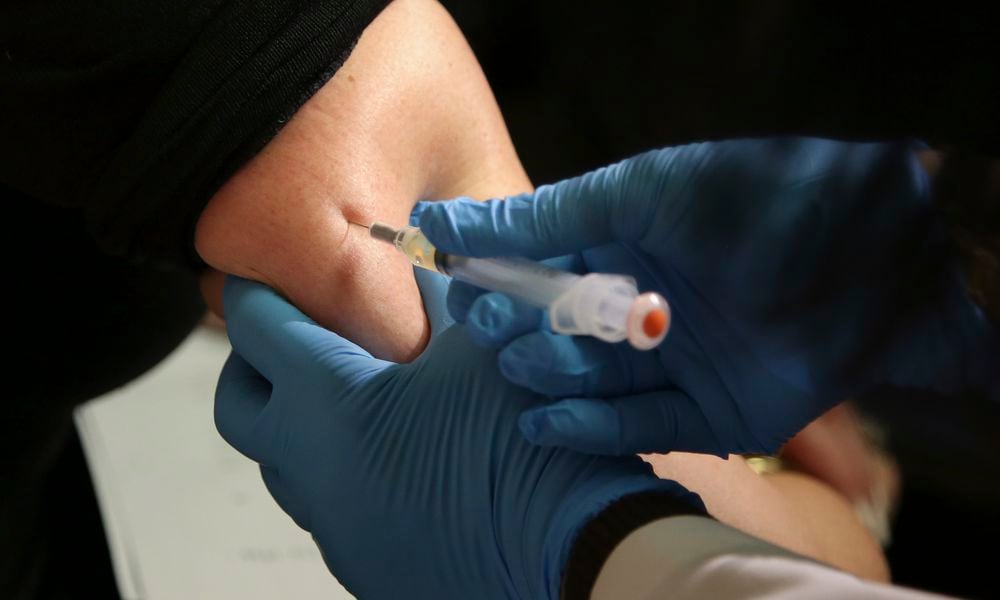 FILE - In this March 27, 2019, file photo, a woman receives a measles, mumps and rubella vaccine at the Rockland County Health Department in Pomona, N.Y. Measles outbreaks in the U.S. and abroad are raising health experts' concern about the preventable, once-common childhood virus. The CDC on April 11, 2024 released a report on recent measles case trends, noting that cases in the first three months of this year were 17 times higher than the average number seen in the first three months of the previous three years. (AP Photo/Seth Wenig, File)