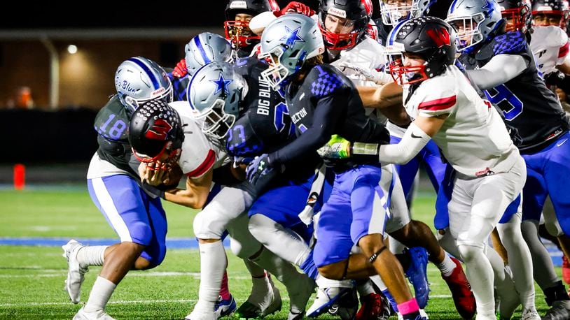 Lakota West quarterback Sam Wiles carries the ball during their football game against Hamilton Friday, Oct. 20, 2023 at Virgil M. Schwarm Stadium in Hamilton. Lakota West won 42-14. NICK GRAHAM/STAFF