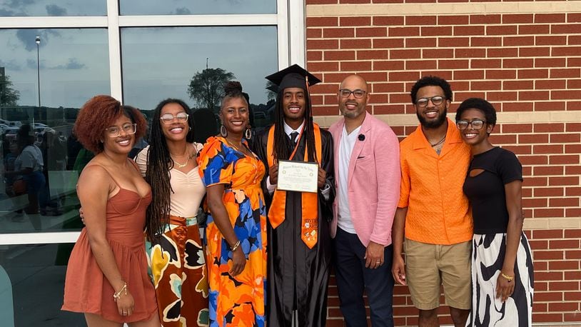 The Lawrence Family (Left to Right - Darajah, Shadayah, Chantel, Dorian, David, Devin and Miannah) at Dorian's graduation from Stivers High last spring. CONTRIBUTED