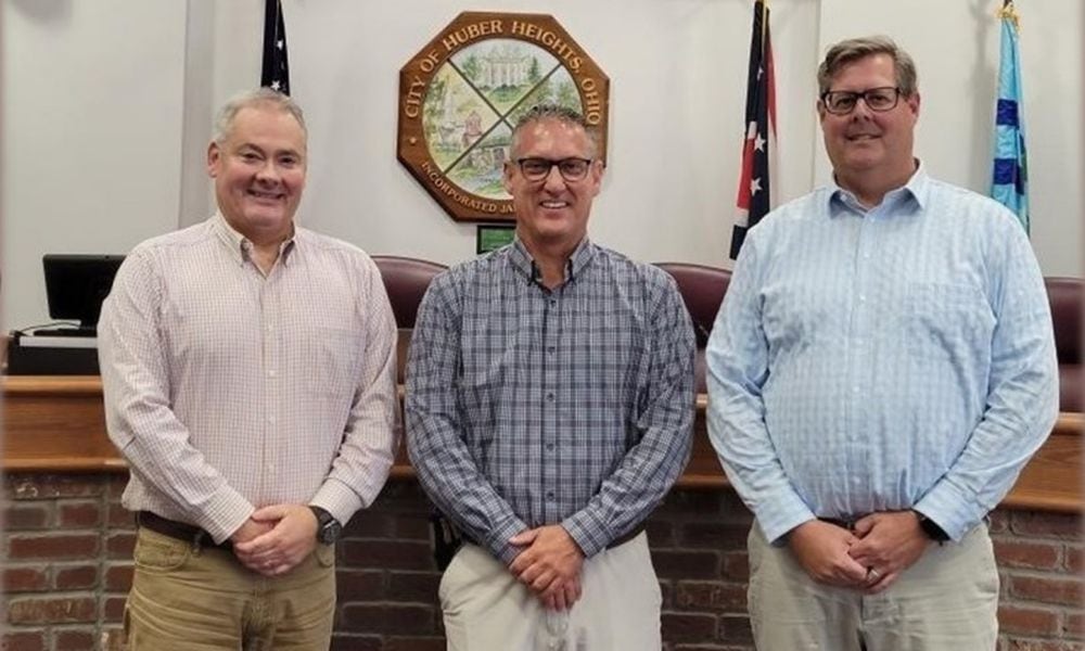 Huber Heights's management team includes city manager John Russell, center, and assistant city managers Alex Zaharieff, left and Aaron Sorrell, right. Contributed photo