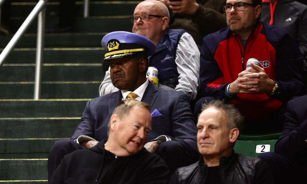 Former Flyer J.D. Grigsby watches Dayton play George Mason on Feb. 21, 2024, at EagleBank Arena in Fairfax, Va. David Jablonski/Staff